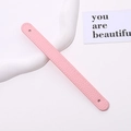 Detailed view of pink pebble grain leather wrist strap with neat stitching for DIY cases - Light Pink