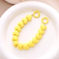 Detail of yellow heart-shaped beaded strap with matte finish and metal ring clasp - Yellow