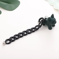 Close-up of matte dark green bulldog pendant and black acrylic chain for phone - Thick Chain Style / Green
