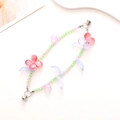 Detail of beaded butterfly phone charm with green beads and magnetic heart clasp - K598 Double Chain Glazed Cat Eye Flower Bracelet Pink