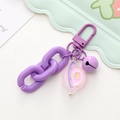 Detail of purple cartoon keychain with spring buckle, chain, bell and heart charm - Purple Chain Planet