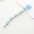 Detailed macro view of macaron silicone beads and heart clip for baby pacifier leash - Blue and White Color Block Heart Style (K1192)