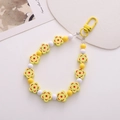 Gelber Blumen-Schlüsselanhänger mit Polka-Dot-Perlen und goldenem Karabinerverschluss - Holz-Look Kirschblüte Gelb (K1167)