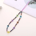 Colorful evil eye polymer clay phone wrist strap with golden beads and vibrant accents - K801 Evil Eye + Soft Clay