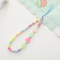 Detail of colorful beaded phone strap with acrylic heart and bear beads on white background - Rabbit Ear Style (K785)