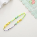 Detailed macro view of acrylic bear phone lanyard with colorful smile and flower beads - Acrylic Smiley Style (K1082)