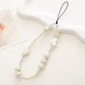 Detail of handmade cream-colored beaded phone strap with heart-shaped and round pearls - Pearlized White Heart Style (K1098)