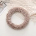 Close-up of a soft plush fuzzy phone wrist strap in lotus pink faux rabbit fur - Khaki