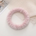 Close-up of soft pink plush phone strap ring with dense faux fur and cozy aesthetic - Pink