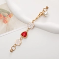 Elegant gold chain accessory with red gem heart and white camellia charms for phone cases - Red
