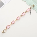 Detail of pink crystal glass bracelet with gold metal frame and magnetic clasp closure - Pink