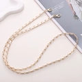Dettaglio della catena intrecciata in pelle bianca e metallo dorato con moschettoni - Catena a tracolla / Bianco (K462)