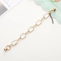 Elegant gold rectangular crystal bracelet with adjustable black extension chain and magnetic clasp - Clear White