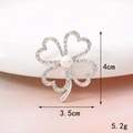 Silver hollow clover brooch with rhinestones and pearl detailing on a white tray - Pearl Clover (D1001)