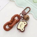 Brown cartoon animal keychain with matte lobster clasp, resin charm, and pearl detail - Coffee Chain Bear