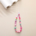 Detail of colorful beaded phone strap with cute bear and heart charms on beige background - Pink Heart Bear Geometric Bead Style (K1164)