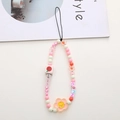 Detailed macro view of colorful acrylic beads and alphabet cubes on a phone strap charm - Pink Sweet Smile Flower Style (K1161)