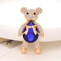 Detail of bear brooch with blue pear-shaped crystal and white zircon pavé setting - Royal Blue Gemstone