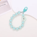 Detail of light blue beaded keychain with smiley face star charm and heart clasp - Star Smiley Face Pendant-Green (K1618)