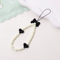 Beaded bow phone strap with cream pearls and black heart charms in a cute trendy design - Phone Chain / K1831 Bowknot Phone Chain White