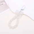 White beaded keychain with a matte bow and glossy pearl beads on a minimalist display - Mermaid Bow Pendant-White (K1810)