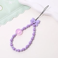 Detail shot of purple beaded phone strap with a bow accent and heart pendant - Phone Chain / K1832 Bowknot Phone Chain Purple