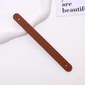 Litchi texture brown leather wrist strap for phone case with minimalist white background - Tan