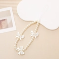 Detailed view of white pearl phone lanyard with three decorative bow accents for wrist strap - Pearl Bowknot Style (Without Bow)