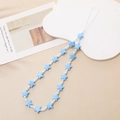 Detail of light blue frosted star beads phone strap with white accents on cream background - Blue (Star Bead)