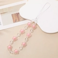 Detailed macro view of pink matte flower beads and clear crystal beads on phone strap - Pink (Pink Frosted Flower)