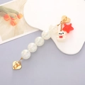 Detail of colorful acrylic phone strap with white bear and red star charm on gold heart clasp - K525 White Bear Bracelet Heart Clasp (With Adhesive)