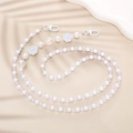 Detail of beaded phone strap featuring white pearls and light blue cat paw charms - Cat Paw Crossbody Style