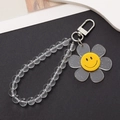Nahaufnahme des grauen Blumenanhängers mit Smiley und Perlenarmband für Schlüsselanhänger - K851 Kristallperlenverschluss (Sonnenblume)