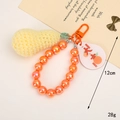 Handmade crochet pear keychain with orange beads and lucky tag on metal ring - Beaded Peanut Style