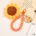 Handmade crochet sunflower keychain with orange beads and academic success charm - Beaded Sunflower Style