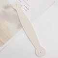 Close-up of cream leather strap with diamond lattice pattern and round holes - Off-white