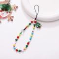 Dettaglio di un cinturino per cellulare natalizio con perline colorate e ciondolo ad albero - Stile Albero di Natale in Perle di Vetro (K1442)