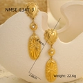 Detailed view of vintage gold bohemian earrings with heart shape and white pearl accents - 18K Gold / Gold Artificial Pearl