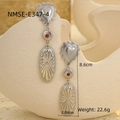 Detail shot of bohemian silver drop earrings with heart and red bead elements - 18K Gold / Steel Color Red Bead