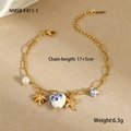 Detail of gold chain bracelet with blue heart charm and starfish pendant on beige surface - White Shell Style (NMSB-F411-1)