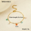 Detail of gold chain bracelet with colorful beaded flower pendants and lobster clasp closure - Colorful