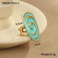 Detail view of oval enamel ring featuring golden spiral lines and turquoise blue finish - Blue Ring