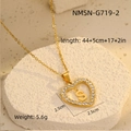 Detailed macro view of gold heart pendant with sparkling zircons and letter S engraving - 18K Gold / Letter S (NMSN-G719-2)