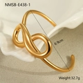 Macro shot of gold knot bangle on white plate showing 6.9cm diameter and weight detail - Twisted Knot Style (NMSB-E438-1) / 18K Gold