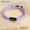Detail of purple woven paracord bracelet with 2.0cm black metal tag and adjustable knot - 18K Gold / Light Purple (NMSB-H523-1)