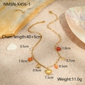 Detail of gold ocean-themed necklace on sand showing length 40+5cm and seashell charms - Heart Pendant Necklace (NMSN-K456-1)