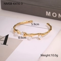 Detailed view of irregular wave gold bangle with white pearls including size measurements - Gold Pearl Style
