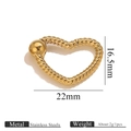 Detailed macro view of heart-shaped stainless steel spring clasp with twist texture - Heart-Gold