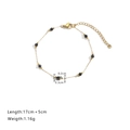 Pulsera de cadena dorada con cuentas de piedra negra y cierre de mosquetón ajustable - Pulsera / Negro