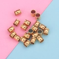 Golden stainless steel drum beads for DIY jewelry making on blue and pink background - 8x8x5 / Gold
